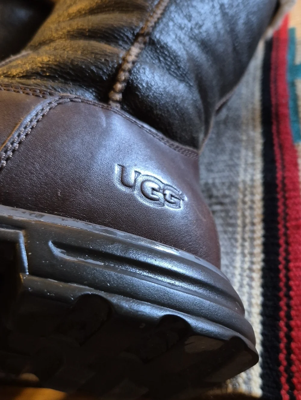 .UGG Brooks Tall model number 5490).VGC. Dark Brown Leather/sherling Insole